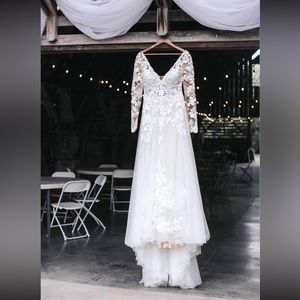 It’s a size 12 and has not been altered at all. Smoke free, pet free home.